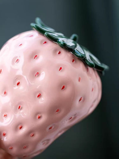 Close-up of ceramic and fabric textures in soft pink and cream tones